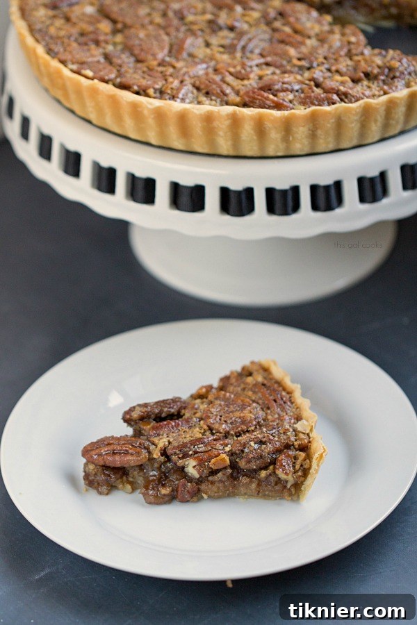 Classic Pecan Pie Tart - This Gal Cooks. This pecan pie is spiced up with the addition of cinnamon and spiced rum!