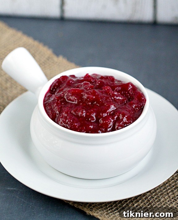 Ruby Red Cranberry Sauce 3 Close-up of fresh, homemade cranberry sauce simmering in a pot