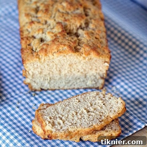 Close-up of a rustic Beer Batter Bread loaf cooling on a wire rack