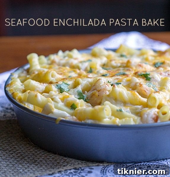 A serving of Seafood Enchilada Pasta Bake with fresh cilantro, ready to eat.