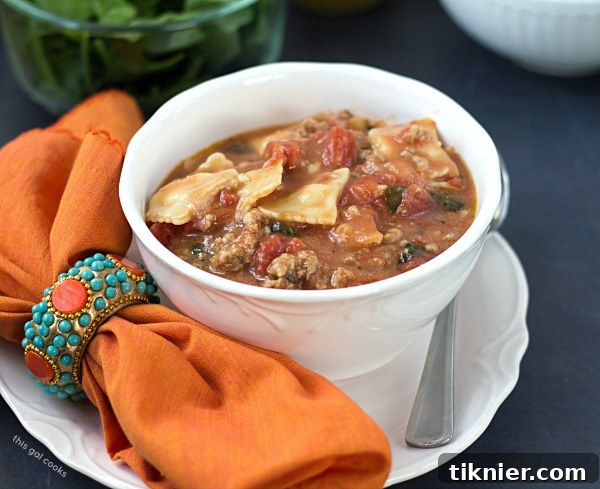 Close-up of a bowl of Easy Ravioli Soup, showcasing the pasta, turkey, and spinach, ideal for a quick and comforting meal.