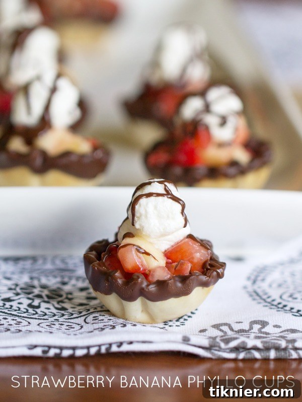 Delicious Strawberry Banana Phyllo Cups with rich Ghirardelli chocolate drizzle for a festive Valentine's dessert