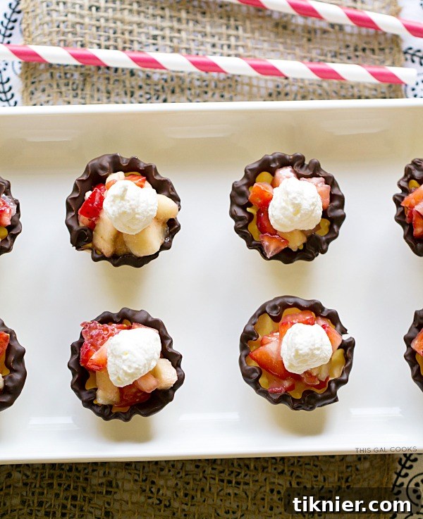 Close-up of freshly chopped strawberries and bananas being prepared to fill delicious Ghirardelli chocolate-dipped phyllo cups