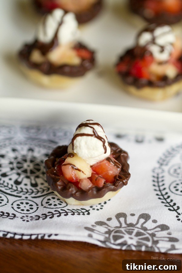 A vibrant platter of Strawberry Banana Phyllo Cups, showcasing their elegance and deliciousness, ideal for parties or a romantic dessert