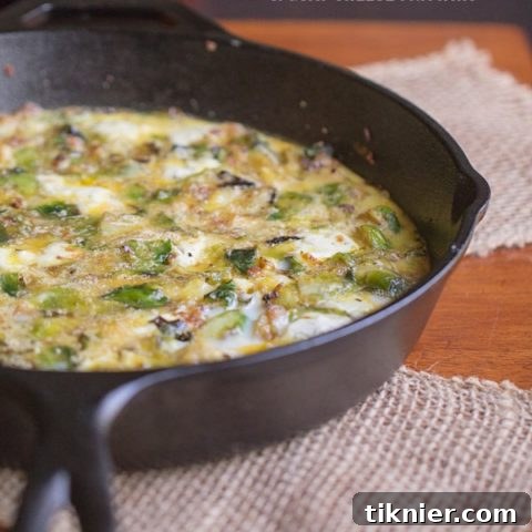 Brussels Sprouts, Bacon and Goat Cheese Frittata recipe card image showcasing the dish.