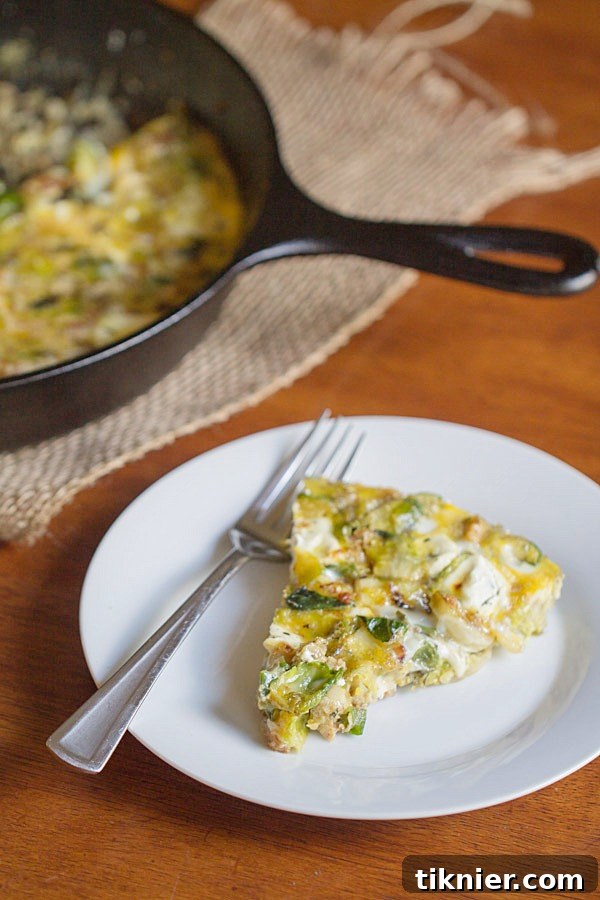 Another perspective of the rustic Brussels Sprouts, Bacon and Goat Cheese Frittata, emphasizing its golden-brown top and savory appeal.