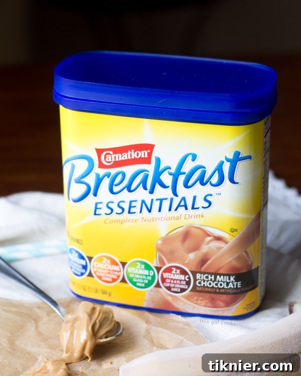 Carnation Breakfast Essentials Milk Chocolate Powder box on a countertop
