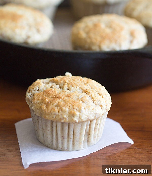 Two Maple Pecan Muffins on a cooling rack
