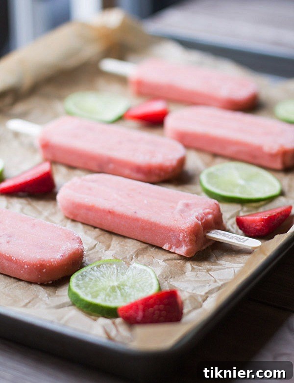 Overhead shot of Strawberry Lime Mint Spritzers and a box of Fruttare Bars, ready to be enjoyed