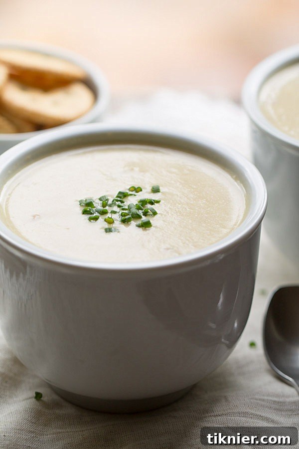 Slow Cooker Potato Ham and Leek Soup served with crusty bread