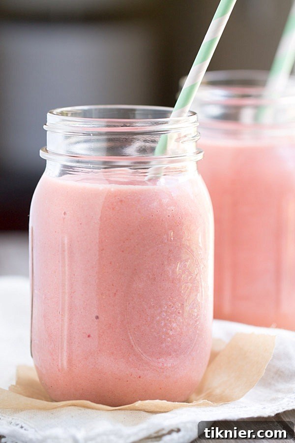 Vibrant Peach Strawberry Smoothie 6 Enjoying a Strawberry Peach Smoothie