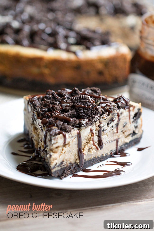 Peanut Butter Oreo Dream Cheesecake 2 The BEST Peanut Butter Oreo Cheesecake. This creamy peanut butter cheesecake is filled and topped with Oreo cookies and drizzled with hot fudge! | This Gal Cooks
