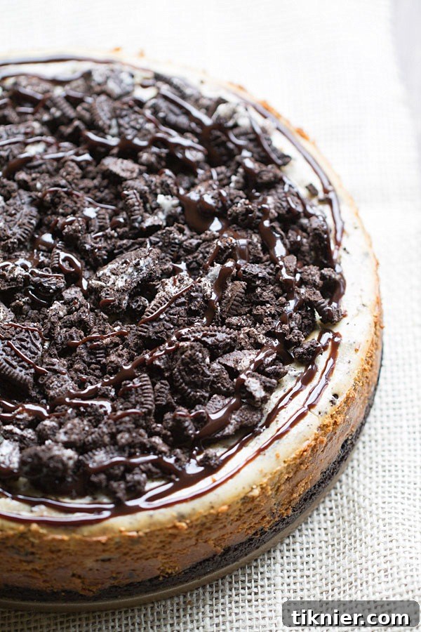 Peanut Butter Oreo Dream Cheesecake 6 The BEST Peanut Butter Oreo Cheesecake. This creamy peanut butter cheesecake is filled and topped with Oreo cookies and drizzled with hot fudge! | This Gal Cooks