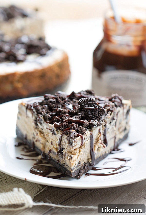 Peanut Butter Oreo Dream Cheesecake 7 The BEST Peanut Butter Oreo Cheesecake. This creamy peanut butter cheesecake is filled and topped with Oreo cookies and drizzled with hot fudge! | This Gal Cooks