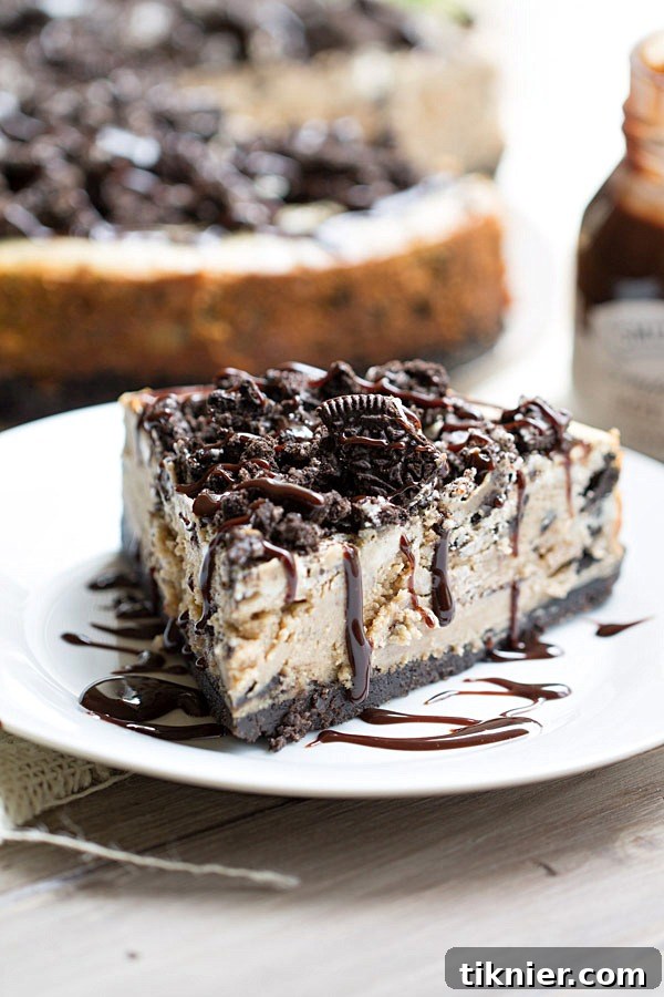 Peanut Butter Oreo Dream Cheesecake 8 The BEST Peanut Butter Oreo Cheesecake. This creamy peanut butter cheesecake is filled and topped with Oreo cookies and drizzled with hot fudge! | This Gal Cooks