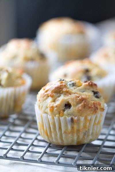 Delicious Sausage, Cheddar, and Olive Oil Muffins - Perfect for a Savory Breakfast