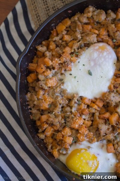 Hearty Sausage and Sweet Potato Hash with Baked Eggs - Comfort Food Breakfast