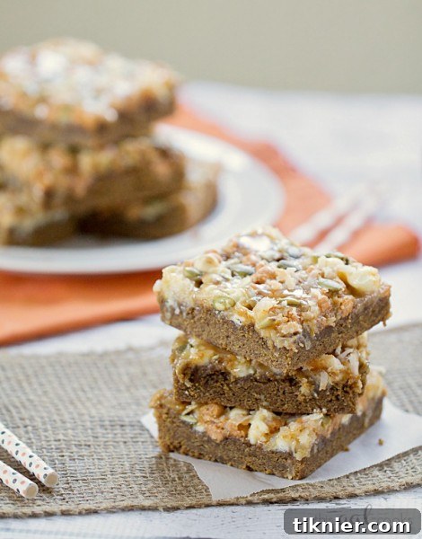 Pumpkin Spice Gooey Magic Bars, a deliciously chewy and spiced dessert.