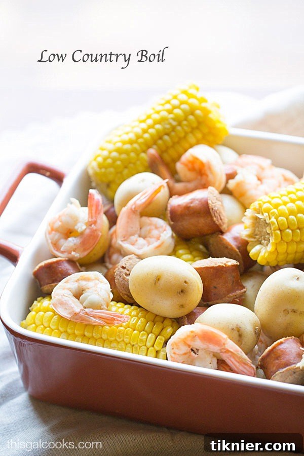 Classic Low Country Boil spread on a table, featuring shrimp, corn, potatoes, and sausage