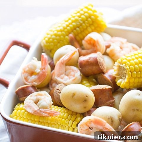 A vibrant Low Country Boil, ready to be served, showcasing all its delicious components