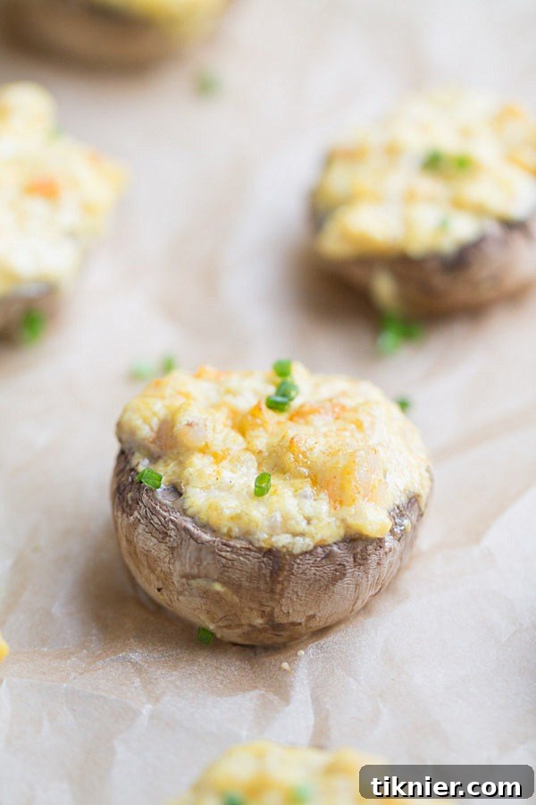 Zesty Curried Shrimp Mushroom Caps 8 Another angle of the delicious Curry Shrimp Stuffed Mushrooms, garnished with fresh herbs.