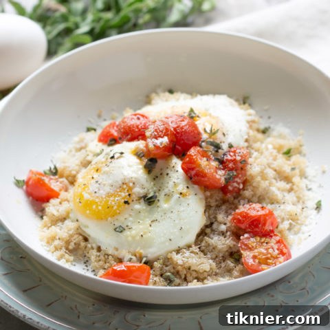 Healthy Quinoa Breakfast Bowl With Eggs And Roasted Tomatoes