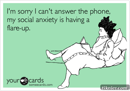 Phone call anxiety: A person looking apprehensive while holding a phone, humorously depicting the preference for texting over talking on the phone.