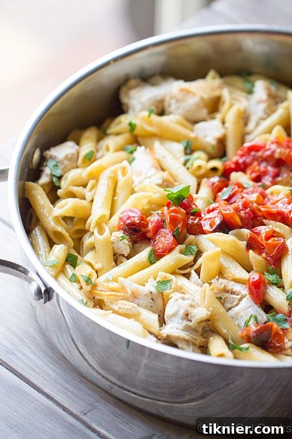 Delicious One Pan Chicken Pasta with Chardonnay Wine Sauce in a skillet, ready to serve.