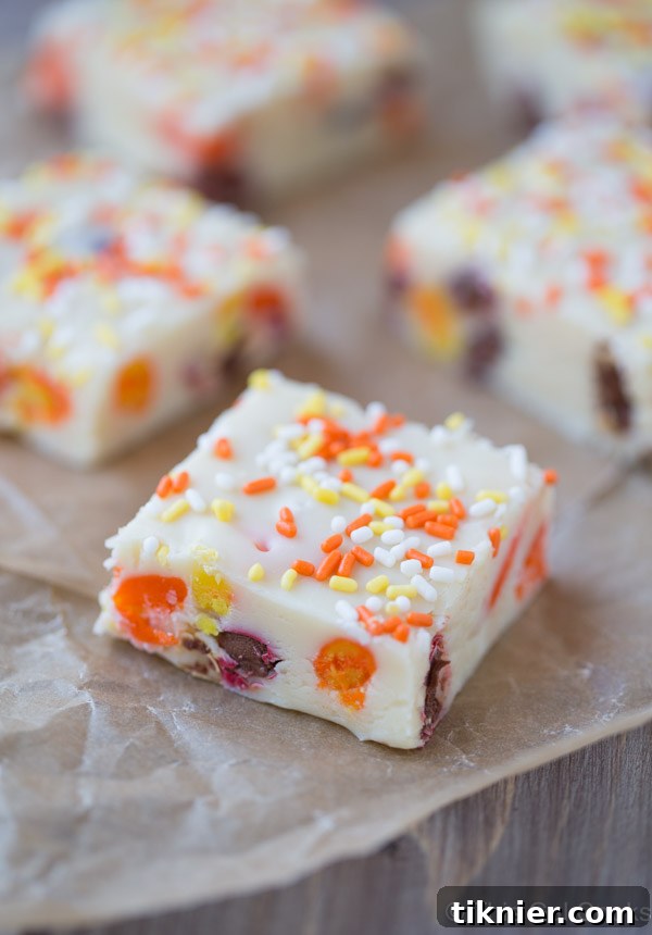 A pan of freshly made Candy Corn M&M White Chocolate Fudge, ready to be chilled and cut.