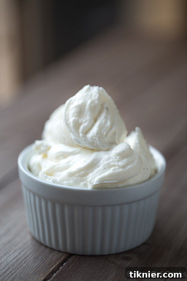 Beautifully piped Vanilla Bean Buttercream Frosting on a cupcake