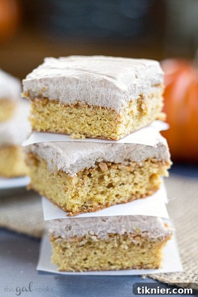 Chewy Pumpkin Snickerdoodle Blondies topped with creamy Nutella Cream Cheese Frosting from This Gal Cooks. Perfect for fall baking.