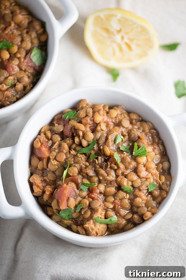 Preparing Slow Cooker Moroccan Lentil Soup for a healthy and satisfying meal. Under 300 calories per serving! | This Gal Cooks #dinner
