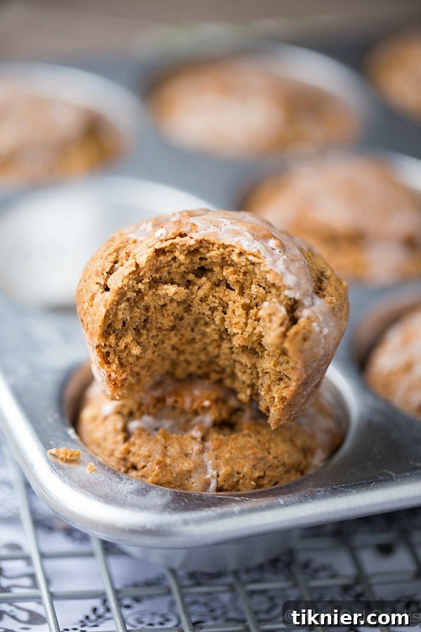 Close-up of a gingerbread muffin with cinnamon sugar glaze, showing its soft texture.