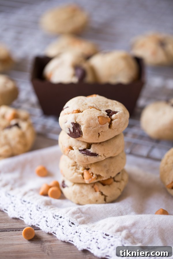 Stacked soft butterscotch chocolate chip cookies with melted chips, a delightful treat for any occasion.