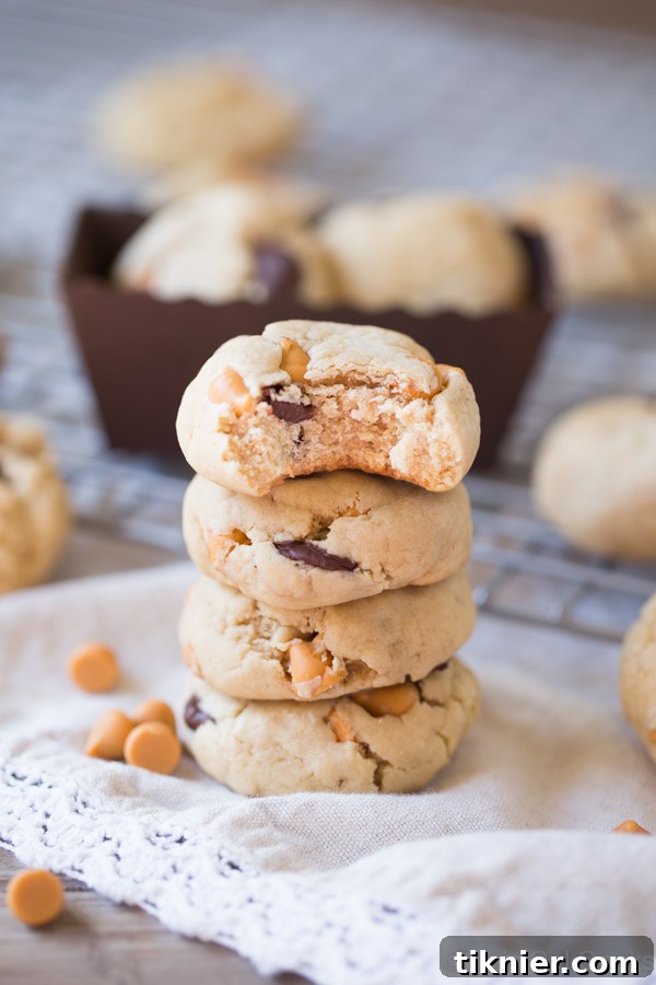 A delightful platter of homemade soft butterscotch chocolate chip cookies, garnished with extra chips, perfect for a cozy gathering.
