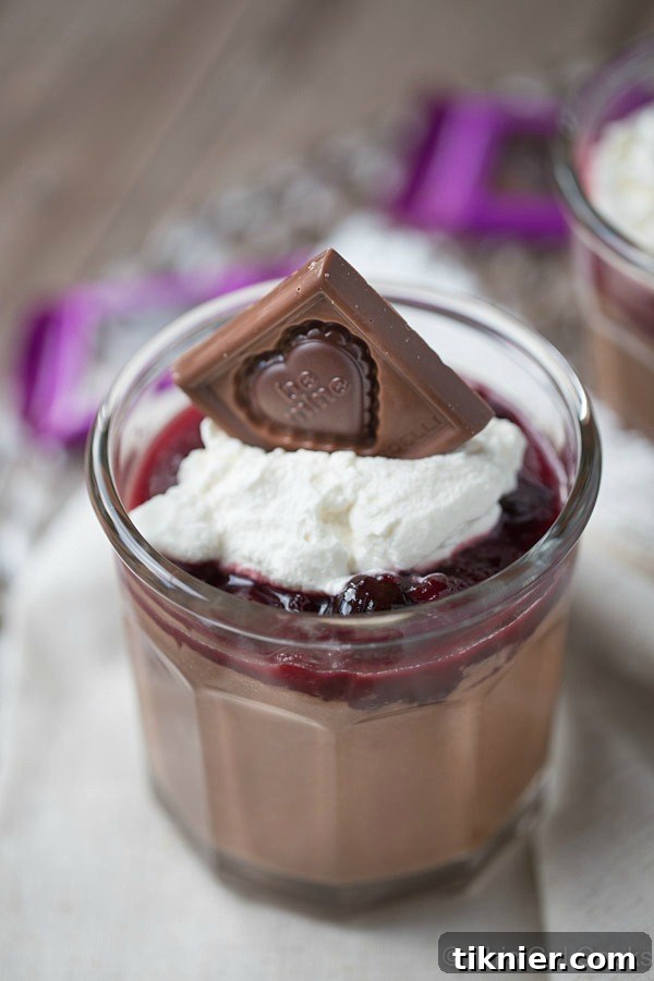 The delightful presentation of homemade chocolate pudding cups, garnished for a festive occasion.