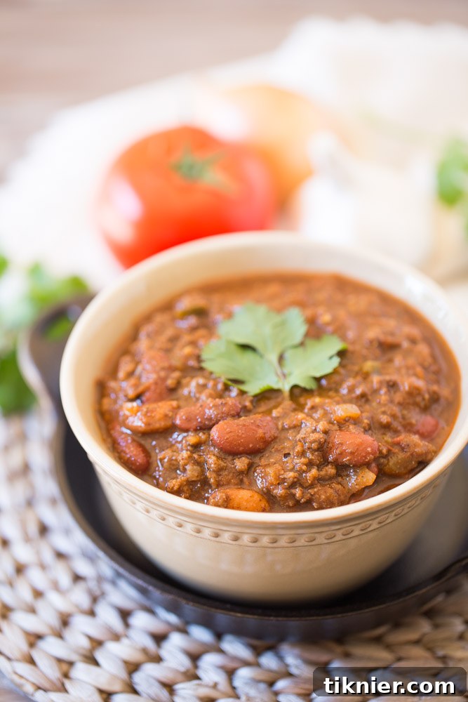 Close-up of hearty beef chili with masa harina, showcasing its rich texture and ingredients.