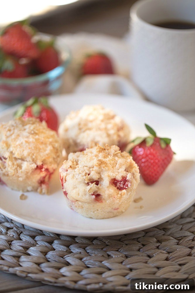 Soft and flavorful strawberry muffins made with Greek Yogurt and Coconut Oil, a delicious no-butter recipe.