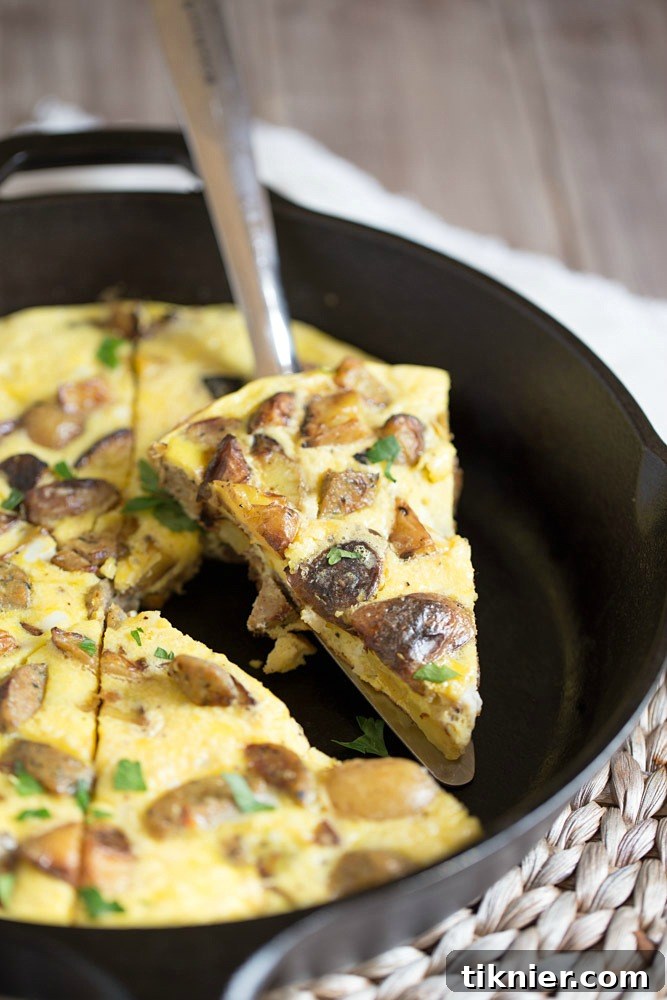 Healthy and delicious Potato Frittata with Chicken Sausage, a perfect breakfast or brunch dish made with leftover grilled potatoes and parmesan cheese. Only 105 calories per serving.