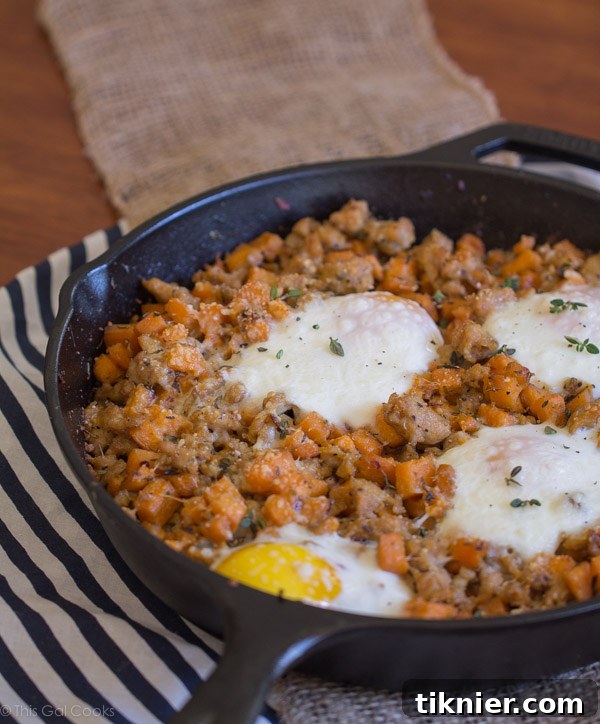 Delicious Sausage and Sweet Potato Hash with Baked Eggs - a healthy and savory breakfast or brunch dish featuring chicken sausage and vibrant sweet potatoes.