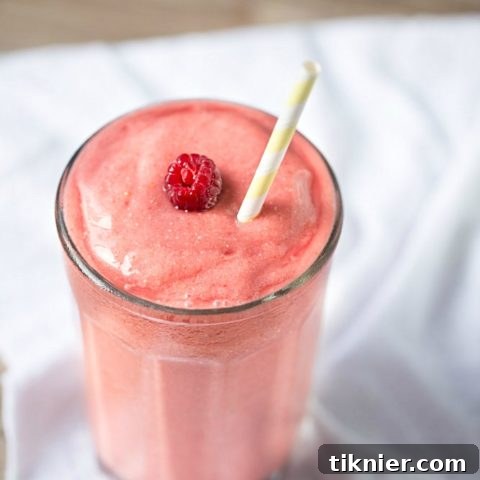Tropical Raspberry Coconut Smoothie, a quick and healthy dairy-free recipe for breakfast.