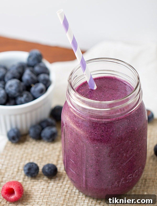 Berry and Toasted Coconut Smoothie - a healthier breakfast option with no refined sugars. 390 calories/serving, perfect for a nutritious start.