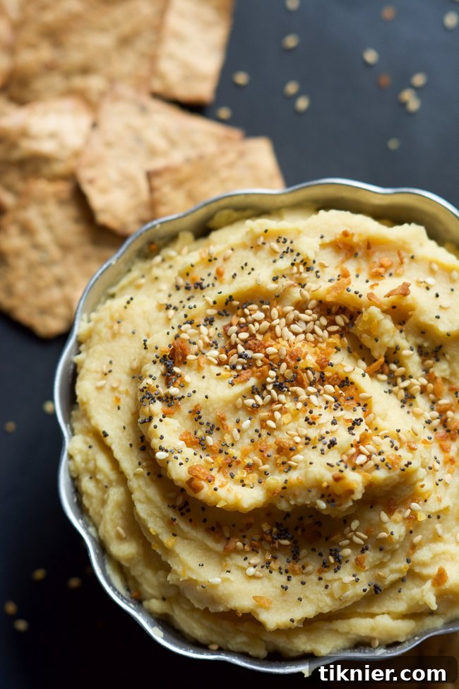 Flavorful Everything Bagel Hummus, topped with everything bagel seasoning.