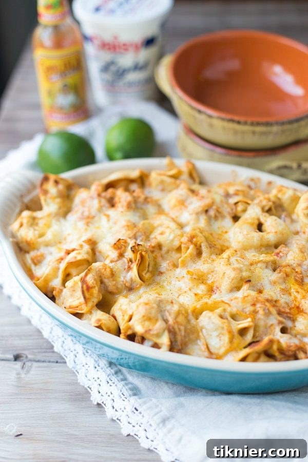 Delicious and easy Chicken Enchilada Casserole with a twist of tortellini