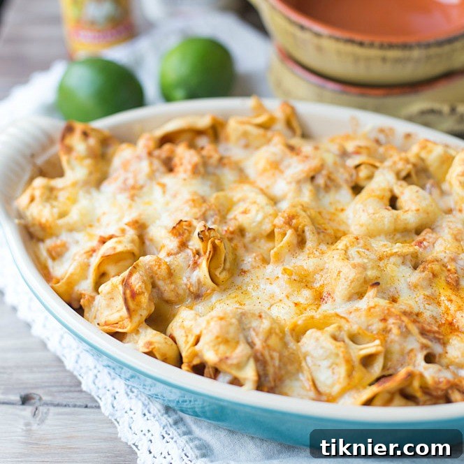Close-up of golden, bubbly Chicken Enchilada Tortellini Bake