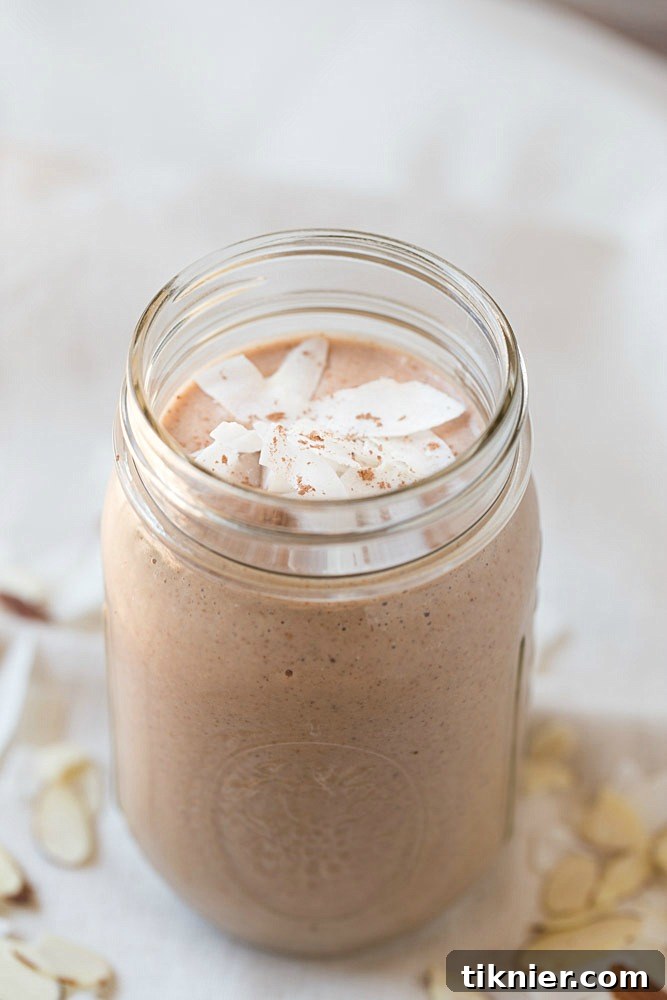 Close-up of a refreshing Almond Joy Protein Shake, emphasizing its smooth texture and appetizing appearance, ideal for a morning boost and packed with nutrition.