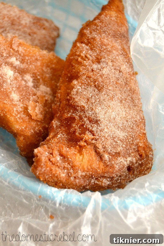 Golden brown Sopapillas, light and airy, dusted with cinnamon sugar