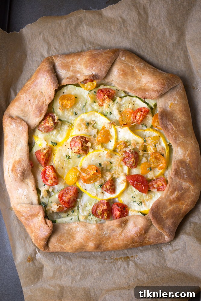 Summer Squash Tart with Roasted Tomatoes - golden crust, fresh squash slices, and juicy tomatoes