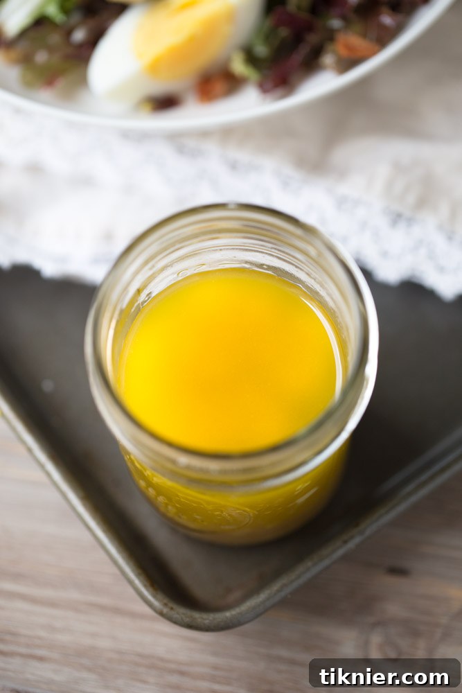 Whip Up Your Own Honey Balsamic Vinaigrette 5 A second perspective of the homemade Honey Balsamic Vinaigrette, showcasing its perfect texture and color. No weird ingredients, just pure flavor. | This Gal Cooks