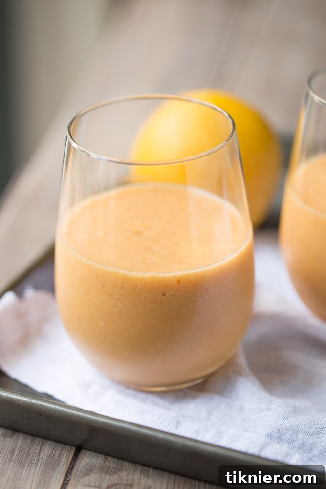 Refreshing Orange Carrot Protein Smoothie with fresh oranges and carrots